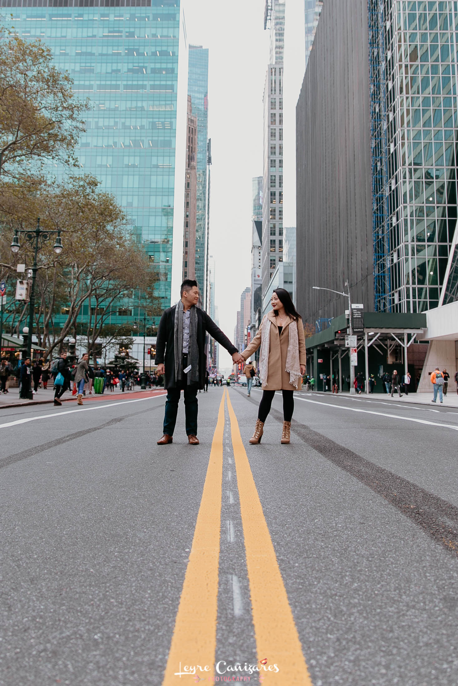 couple photos near bryant park in the middle of the road