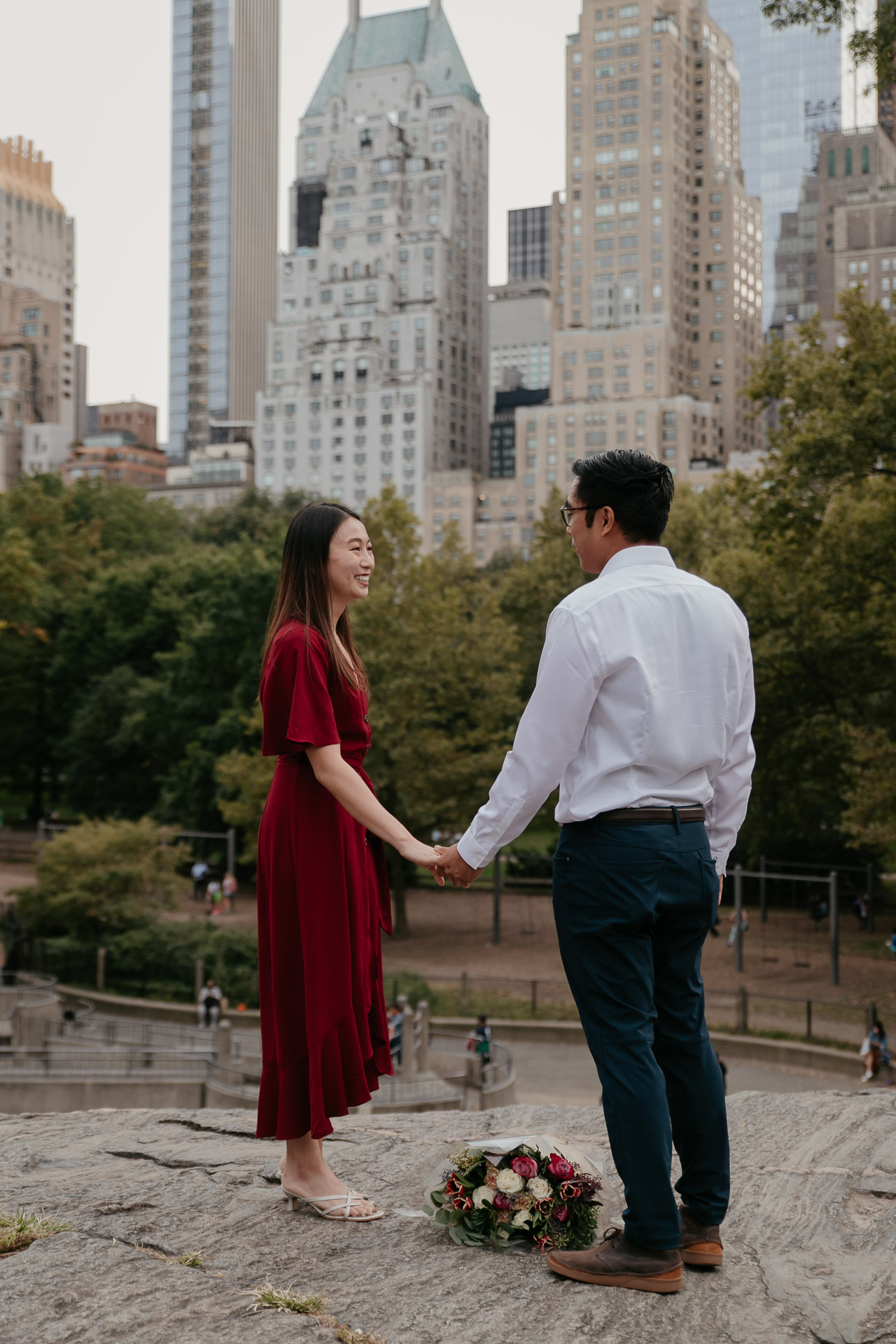 lovely and surprise proposal in the umpire rock, central park, NYC