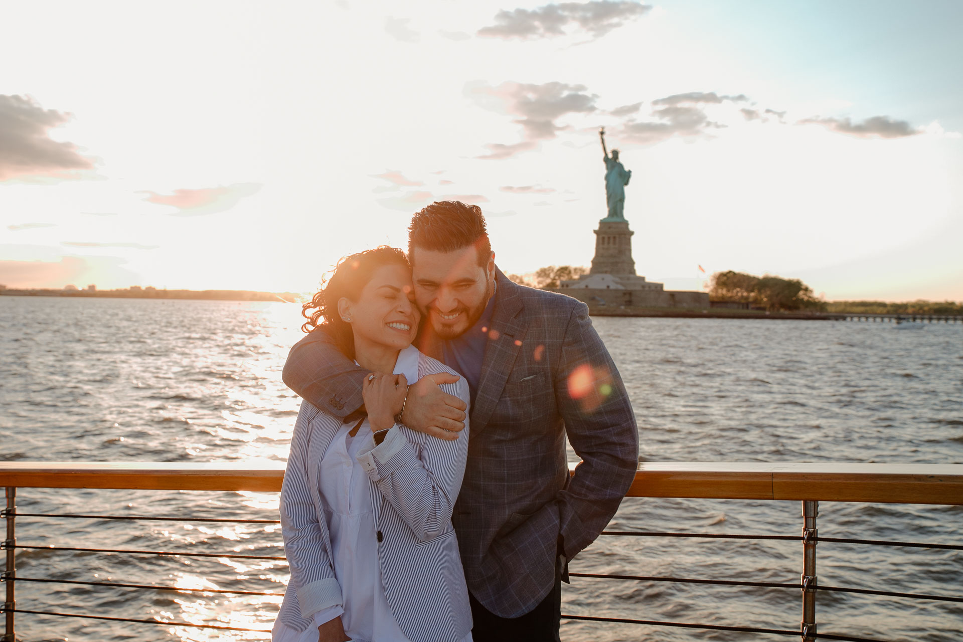 surprise proposal photoshoot on a boat with the liberty statue