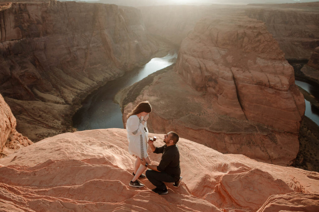 surprise proposal at the horseshoe bend in arizona at sunset